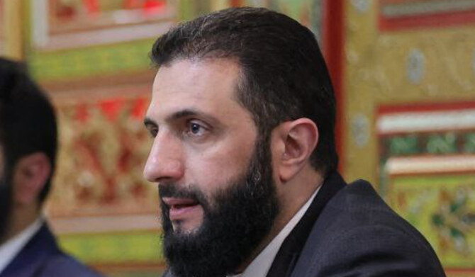Syria's interim leader Ahmed Al-Sharaa attending a meeting with officials and local leaders in the western coastal city of Tartus. (AFP)