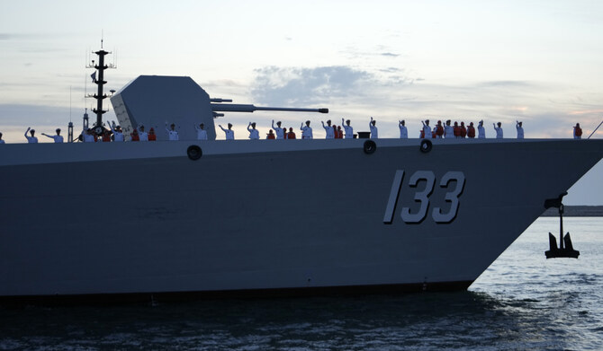 Chinese navy troops attending a joint naval drill with Iran and Russia wave as they stand on the deck of their warship in an official arrival ceremony at Shahid Beheshti port in Chabahar in the Gulf of Oman, Iran, Tuesday, March 11, 2025. (AP)