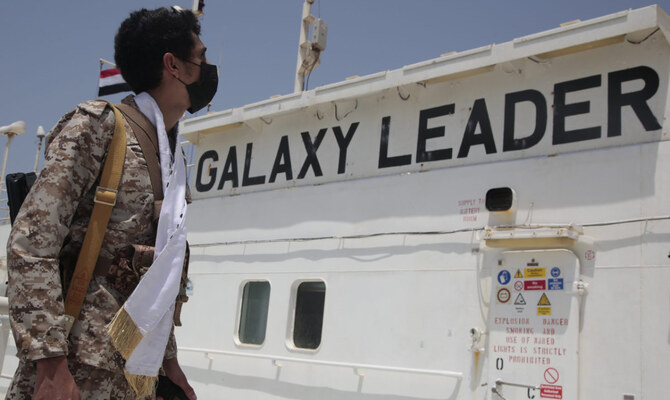 A Houthi soldier stands alert on board of the Israeli Galaxy ship which was seized by the Houthis, in the port of Saleef, near Hodeidah, Yemen, May. 12, 2024. (AP)