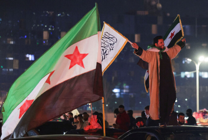 Syrians celebrate after the Kurdish-led and US-backed Syrian Democratic Forces, which controls much of Syria's oil-rich northeast, has signed a deal agreeing to integrate into the country's new state institutions, on March 11, 2025. (REUTERS)