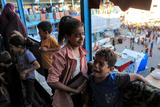 In this photo taken on July 6, 2024, children react after Israeli bombardment as they take refuge at the Jaouni school run by the UN Relief and Works Agency for Palestine Refugees (UNRWA) in Nuseirat in the central Gaza Strip. (AFP)