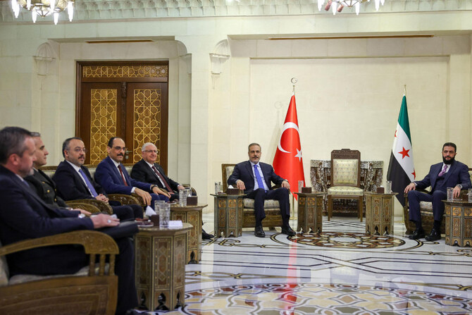 Turkish Foreign Minister Hakan Fidan (2-R) meets with Syria's interim President Ahmed al-Sharaa in Damascus on March 13, 2025. (Turkish Foreign Ministry press service handout via AFP)