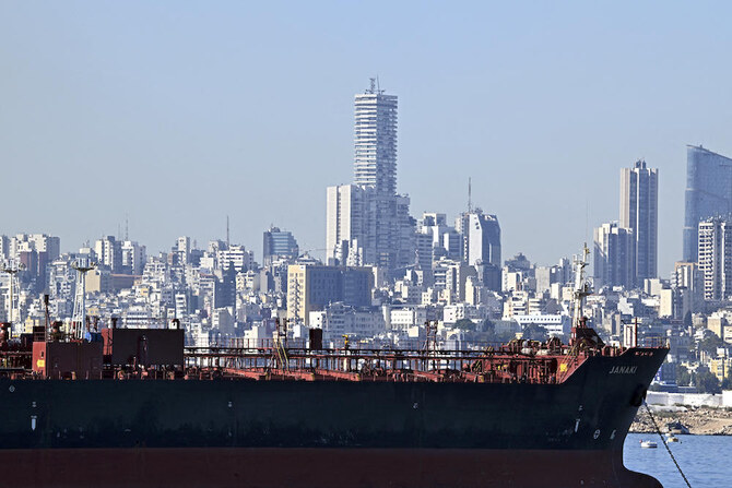 International donors have called on the Lebanese authorities to implement major reforms to unlock funding. Above, an oil tanker is docked off the coast of Beirut on Oct. 24, 2024. (AFP)