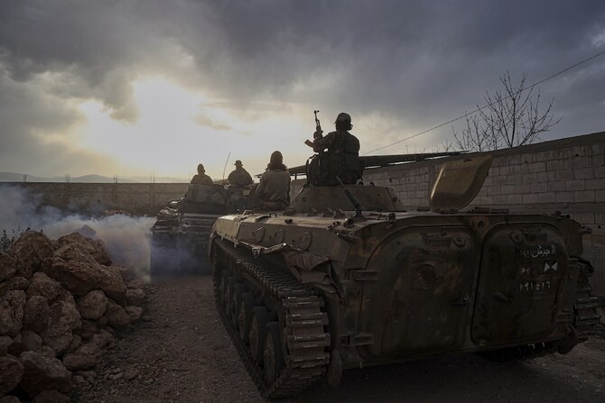 Syrian troops maneuver in the village of Hawsh al-Sayyid Ali, located 2 km (1.24 miles) from the Lebanon border, Syria, Monday, March 17, 2025. Lebanon's president ordered troops to retaliate for gunfire from the Syrian side of the border after renewed fighting broke out overnight along the frontier. (AP)