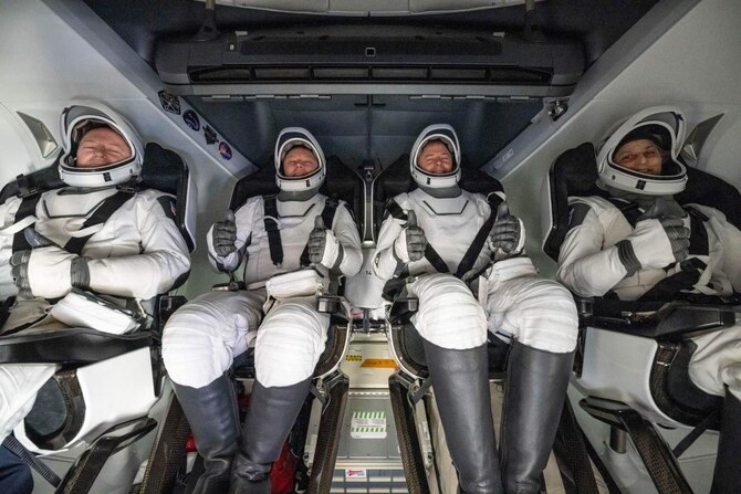 From left: NASA astronaut Butch Wilmore, Roscosmos cosmonaut Aleksandr Gorbunov, NASA astronauts Nick Hague and Suni Williams inside a SpaceX Dragon spacecraft shortly after landing in the waters off the coast of Tallahassee, Florida, on March 18, 2025. (NASA/AFP)