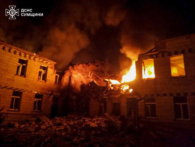 A fire in a hospital building can be seen following a strike in Krasnopillya, Sumy region, amid the Russian invasion of Ukraine. (AFP)