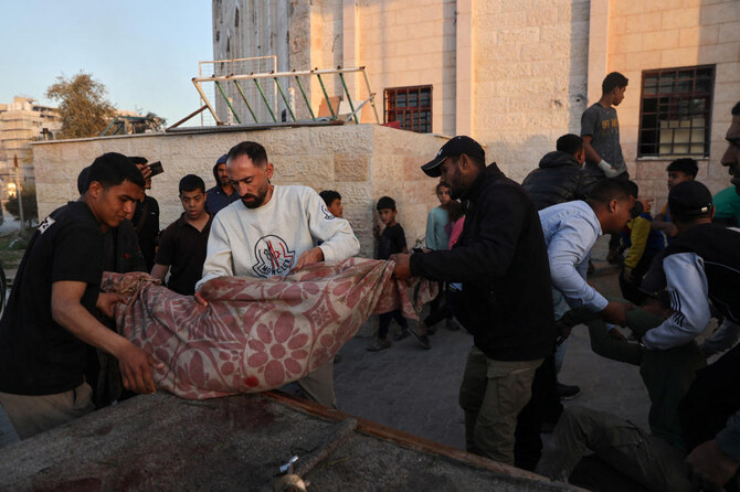 Palestinians transport casualties following an Israeli strike, in Beit Lahia in the northern Gaza Strip Mar. 19, 2025. (Reuters)