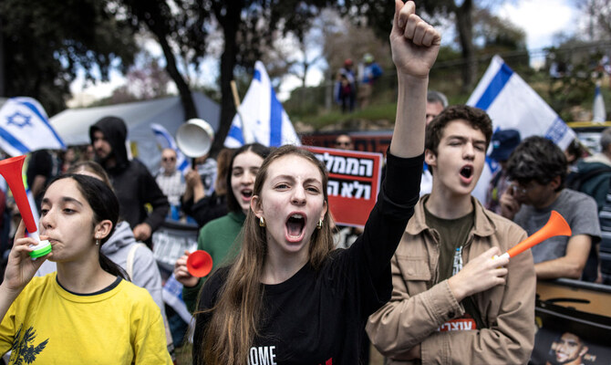 A young woman shouts slogans during a protest in against Israel's Prime Minister Benjamin Netanyahu, in Jerusalem on March 19, 2025, calling for an end to the war in Gaza. (AFP)