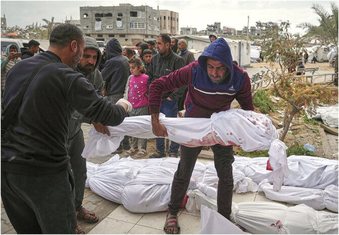 The bodies of victims of an Israeli army airstrike are prepared for burial on March 19, 2025, at Indonesia Hospital in Beit Lahia, northern Gaza Strip. AP)