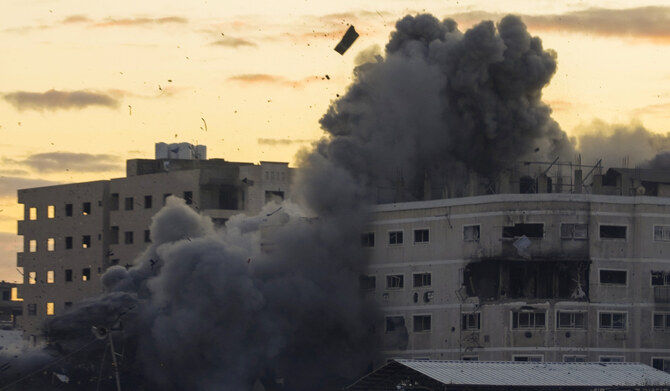Smoke and debris rises from a building after it was targeted by an Israeli army strike, following evacuation orders for residents, in Gaza City, Saturday, March 22, 2025. (AP)
