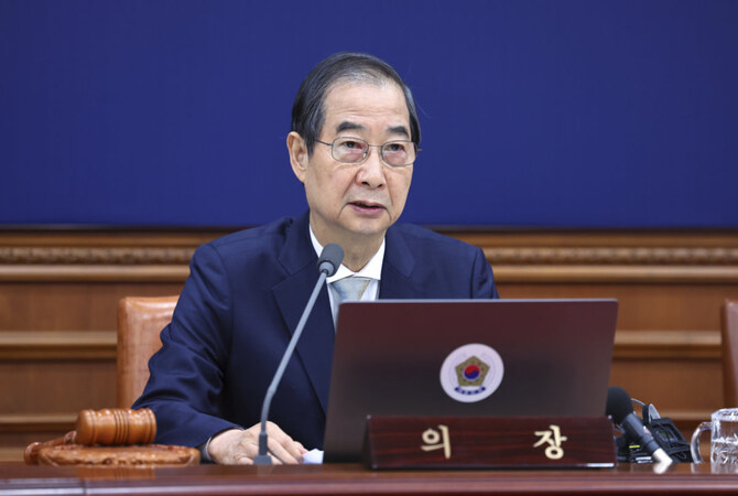 South Korea's Prime Minister Han Duck-soo, who became the country's acting leader after President Yoon Suk Yeol's impeachment, speaks during a cabinet meeting at the government complex in Seoul, South Korea, on Dec. 24, 2024. (Yonhap via AP, File)