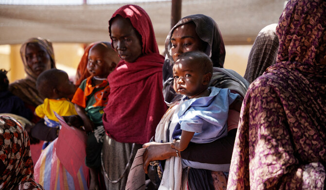 A handout photograph, shot in January 2024, shows women and babies at the Zamzam displacement camp, close to al-Fashir in North Darfur, Sudan. (REUTERS)