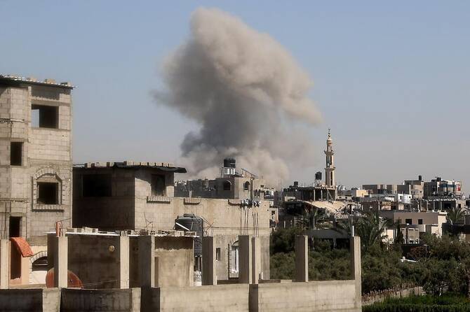 Smoke billows from an Israeli strike at Bureij camp in the central Gaza Strip, on March 27, 2025. (AFP)