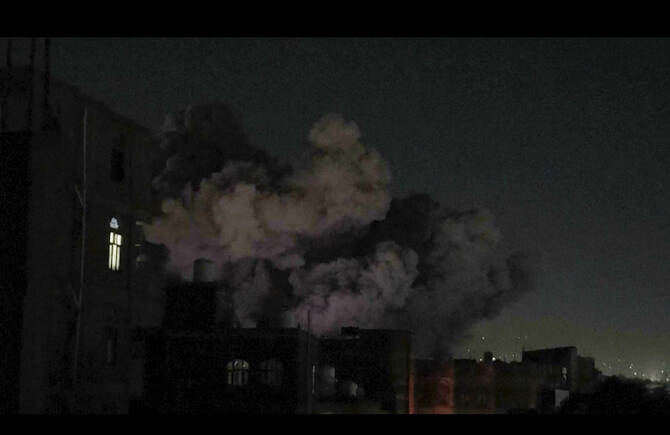 In this image made from video, smoke rises after a blast in Sanaa, Yemen, Friday, March 28, 2025. (AP Photo)