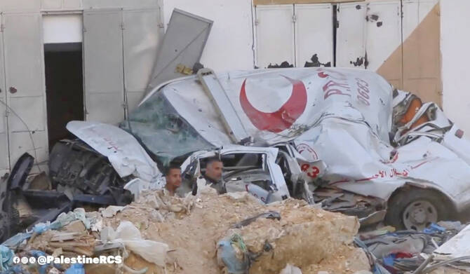A destroyed ambulance is seen amidst the rubble outside the damaged PRCS Al-Amal Hospital, amid the ongoing conflict between Israel and Palestinian Islamist group Hamas, in Khan Younis, Gaza April 7, 2024, as seen in this screen grab taken from a handout video. (REUTERS)