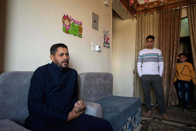 Egyptian Emad Mouawad, 44, talks during an interview at his home in Abu Shanab village in Fayyoum governorate on March 25, 2025, after he was freed with two compatriots from captivity in the hands of Sudanese paramilitary forces. (AFP)