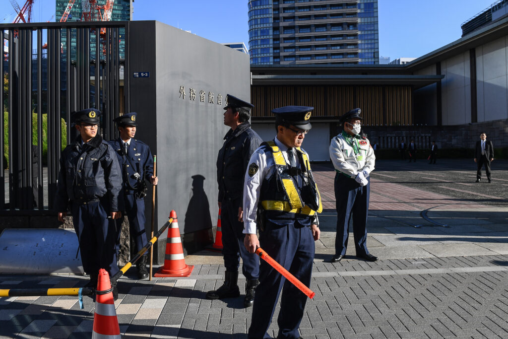 Police stand outside Japan's Ministry of Foreign Affairs Iikura Guest House. (AFP)