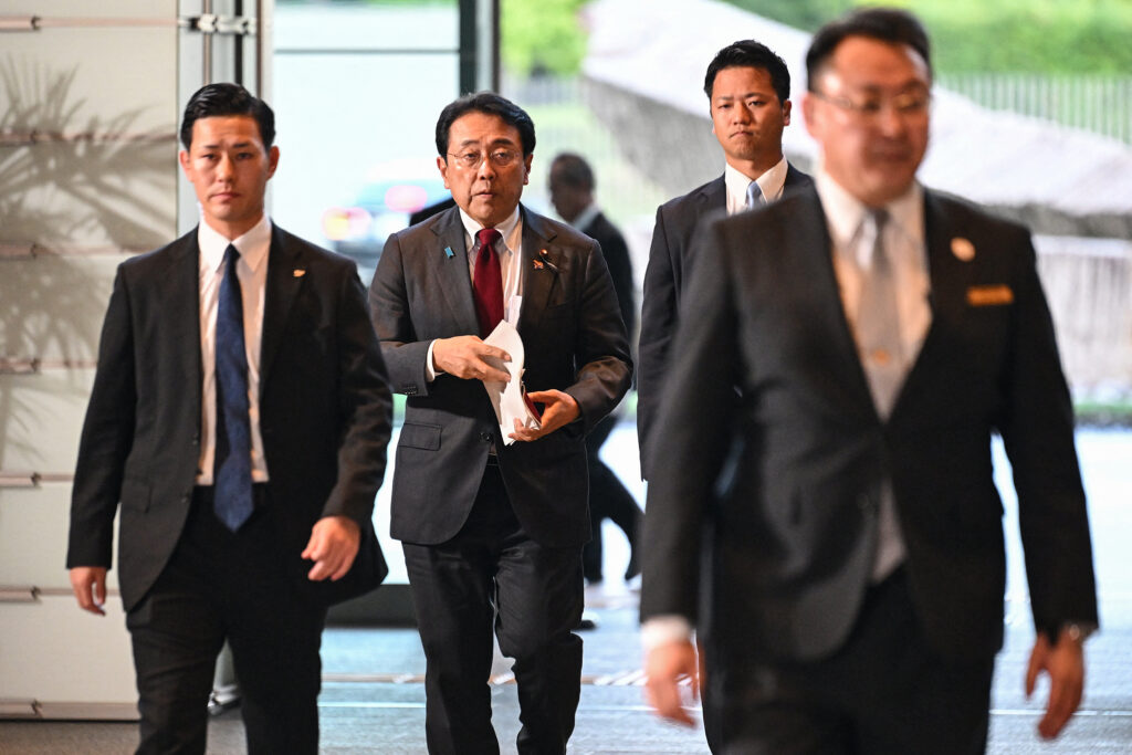 Japan's minister in charge of economic security, Ryosei Akazawa (2nd L), arrives at the prime minister's office in Tokyo on October 1, 2024. (AFP)
