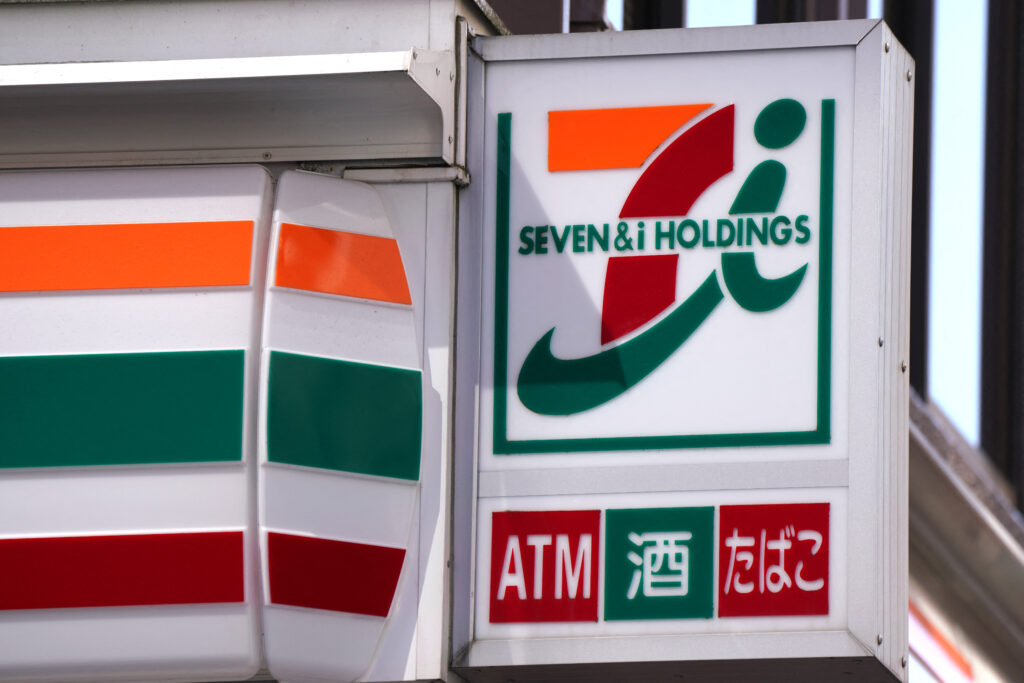 Signage of Seven&i Holdings is displayed at a 7-Eleven convenience store in central Tokyo on February 27, 2025. (AFP)
