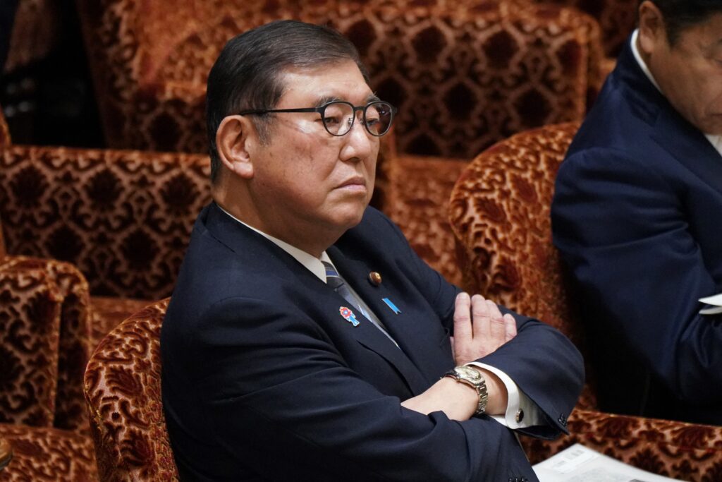 Japan's Prime Minister ISHIBA Shigeru waits for a session of the House of Councillors Budget Committee to begin inside the Diet in Tokyo on March 14, 2025. (AFP)