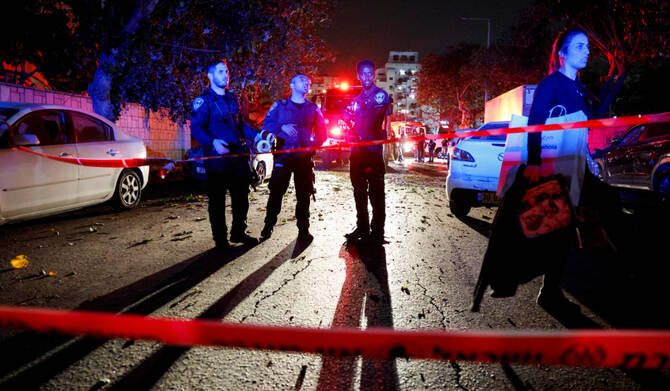 Emergency personnel gather at an impact scene following a hit by a rocket fired from the Gaza strip towards Israel, in Ashkelon, Israel April 6, 2025. (REUTERS)