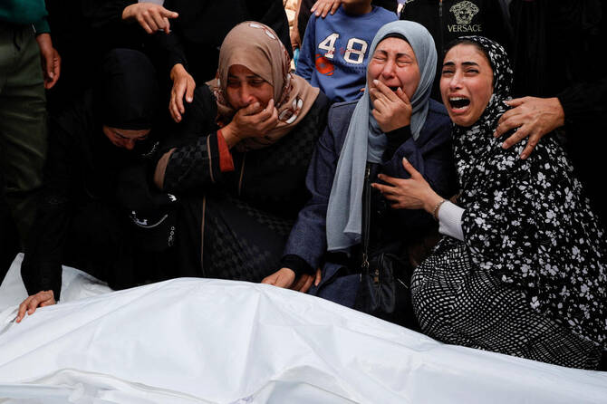 Mourners react next to the bodies of Palestinians killed in Israeli strikes, at Nasser hospital, in Khan Younis in the southern Gaza Strip on April 7, 2025. (Reuters)