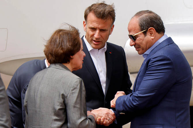 Egypt's President Abdel Fattah al-Sisi and French President Emmanuel Macron shake hands upon arrival at El Arish International Airport near Egypt's northeastern city of Arish in the north of the Sinai peninsula, about 55 kilometres west of the border with the Gaza Strip, Egypt April 8, 2025.(Reuters)