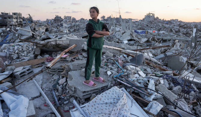 A girl stands amidst rubble in Jabalia in the northern Gaza Strip on April 14, 2025. (AFP)