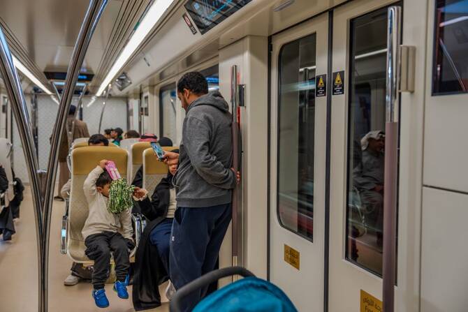 A glimpse inside a Riyadh Metro train, showcasing the diverse commuters embracing the city’s new transportation era. (AN Photo/Huda Bashatah)