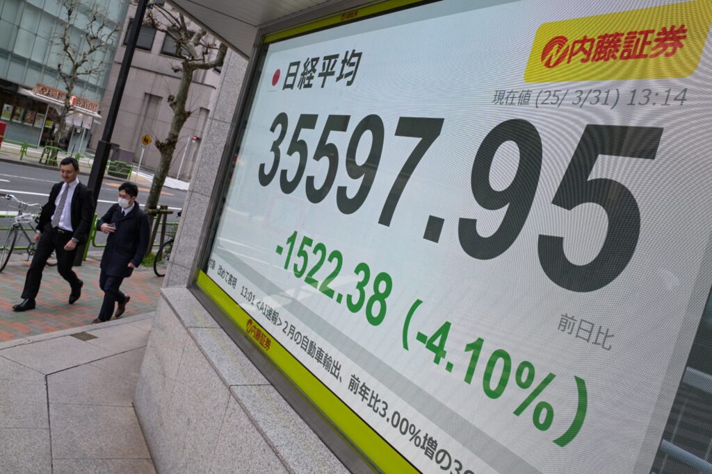 The Nikkei index closed more or less flat at 35,624.48, having failed to sustain the morning's bounce. (AFP)