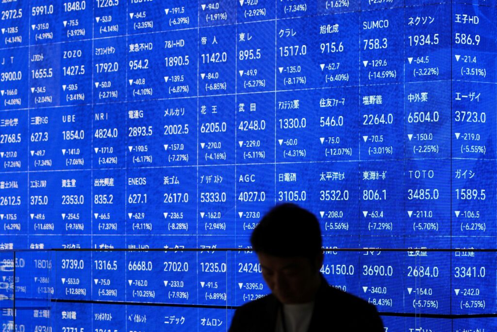 Tokyo’s Nikkei 225 index lost nearly 8% shortly after the market opened and futures trading for the benchmark was briefly suspended. It closed down 7.8% at 31,136.58. (AFP)