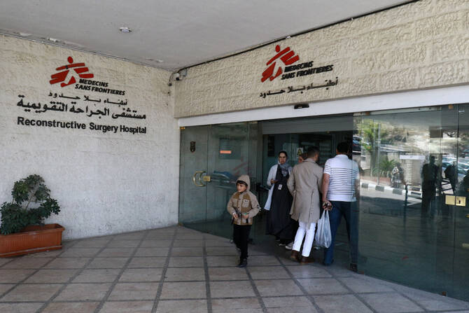 Patients enter the Al-Mowasah hospital, run by medical charity Doctors Without Borders, in Amman, on April 15, 2025. (AFP)