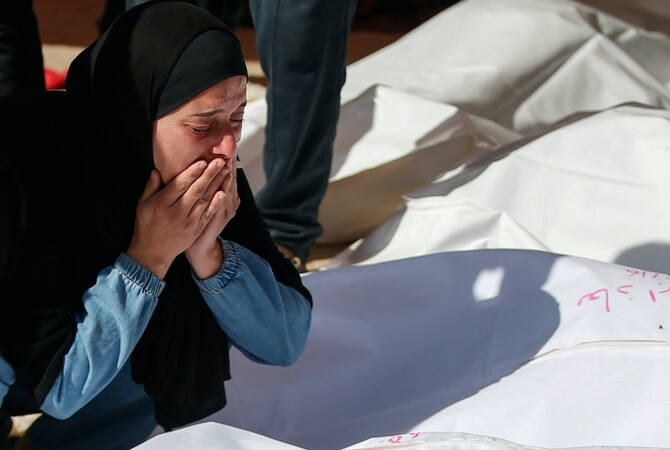 A mourner reacts during the funeral of Palestinians killed in Israeli strikes, at the Indonesian hospital in Beit Lahia, in the northern Gaza Strip on Friday. (Reuters)
