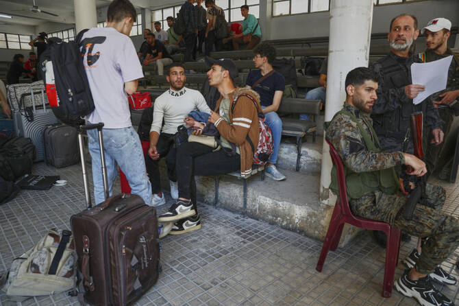Druze students who fled their dormitories at Damascus University arrive to take shelter in Jaramana suburb, a day after clashes between members of the minority Druze sect and pro-government fighters in the southern suburb of Jaramana, Damascus on April 29, 2025. (AP)
