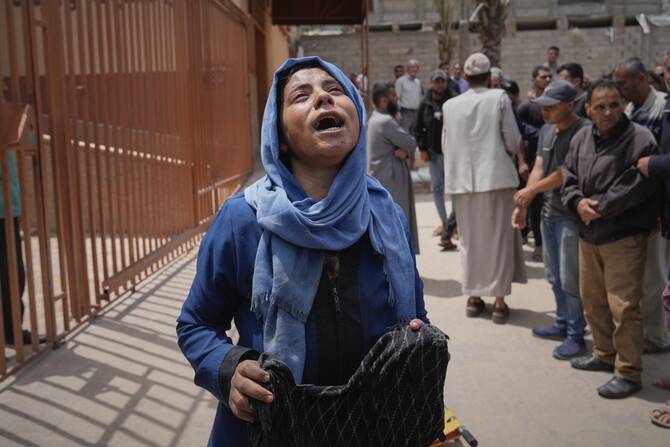 Islam Abu Sahloul mourns the death of her sister Lamia, 32, who was killed when an Israeli army strike hit a house killing at least five people, in Khan Younis, in the southern Gaza Strip, Thursday, May 1, 2025. (AP)