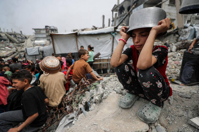 Two months into Israel's full blockade on aid into Gaza, humanitarians described Friday horrific scenes of starving, bloodied children and people fighting over water, with aid operations on the