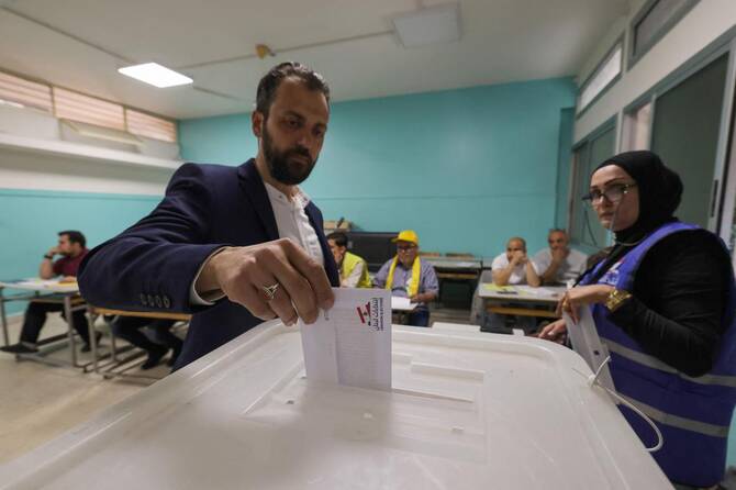 Lebanese voters take part in a first round of municipal elections, at a polling station in the Ghobeiry neighbourhood of Beirut's southern suburb on May 4, 2025. (AFP)
