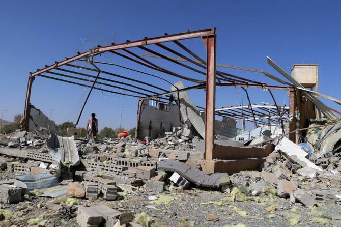 A Yemeni man checks the rubble of a building hit in US strikes in the northern province of Saada on April 29, 2025. (AFP)