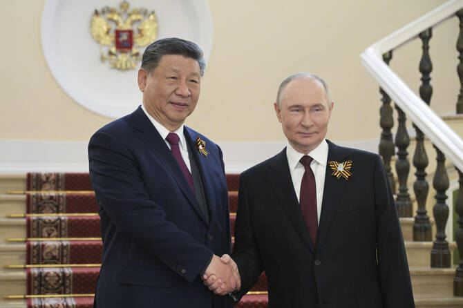 China, Russia vow to strengthen cooperation on international law matters, state media reports. (AP)