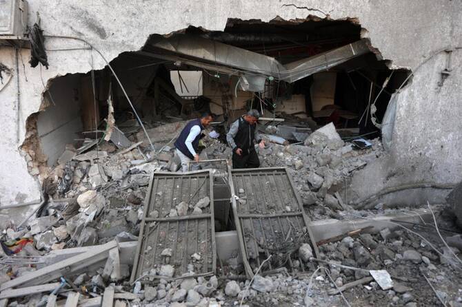 People check the destruction in the aftermath of an Israeli strike on the Al-Ahli hospital, also known as the Baptist or Ahli Arab hospital, in Gaza City on April 13, 2025. (File/AFP)