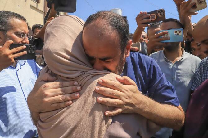 Al-Shifa former hospital director Mohammed Abu Salmiya who was detained by Israeli forces since November, is welcomed by relatives after his release alongside other detainees, at Nasser hopsital in Khan Yunis in the southern Gaza Strip, July 1, 2024. (File/AFP)