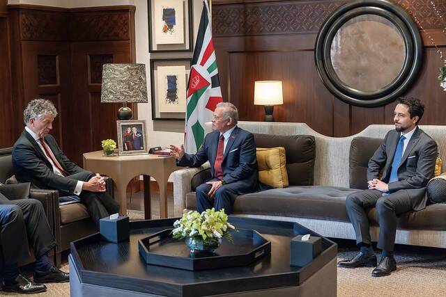 King Abdullah II of Jordan, the UK National Security Adviser Jonathan Powell, and Crown Prince Hussein during the meeting at Al-Husseiniya Palace in Amman. (Petra)