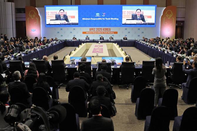 South Korean Trade Minister Cheong In-kyo (seen on screens) delivers a speech during the opening ceremony of APEC 2025 Trade Ministers Meeting at the Jeju International Convention Center. (File/AFP)