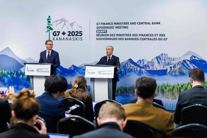 Tiff Macklem (L), Governor of the Bank of Canada looks on as Fracois-Philippe Champagne, Canada’s Minister of Finance and National Revenue speaks at their closing press conference during the G7 Finance Ministers and Central Bank Governors’ Meeting in Banff, Alberta, on May 22, 2025. (AFP)