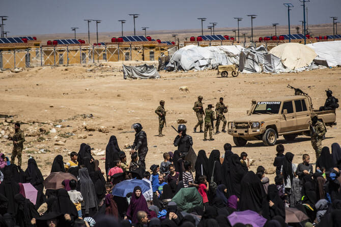Members of the Syrian Kurdish Asayish security forces gather at the Kurdish-run Al-Hol camp, which holds relatives of suspected Daesh group fighters in the northeastern Hasakeh governorate. (AFP)