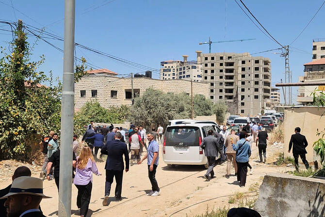 European Union diplomats leave in a rush after shots were fired by the Israeli military as they visited a refugee camp in Jenin in the occupied West Bank on May 21, 2025. (AFP)