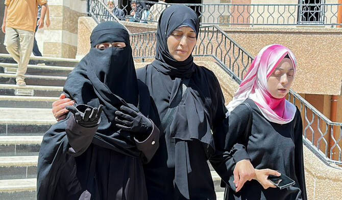 Palestinian Pediatrician Alaa Al-Najjar (L), who lost lost nine of her children in an Israeli strike on Friday, according to medics, reacts at Nassser hospital in Khan Younis, in the southern Gaza Strip, May 25, 2025. (REUTERS)