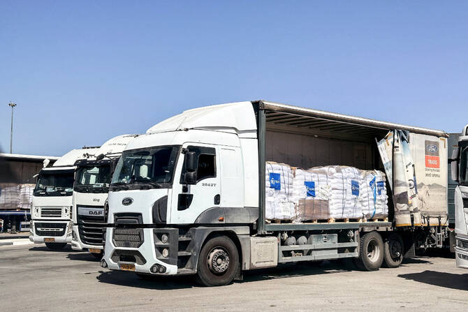 Trucks carrying aid are seen at the Kerem Shalom crossing between Israel and Gaza on May 25, 2025. (REUTERS)