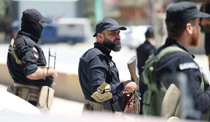 This handout picture released by the Syrian Interior Ministry Facebook page shows Syria's security forces standing guard in a street in the mostly Druze and Christian Jaramana suburb of Damascus on April 29, 2025. (AFP)