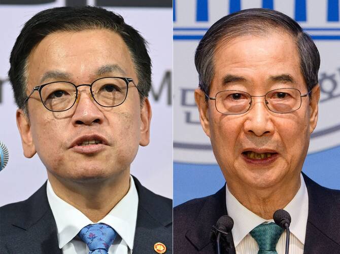 South Korea's Finance Minister Choi Sang-mok (L) and former acting president Han Duck-soo. (AFP)